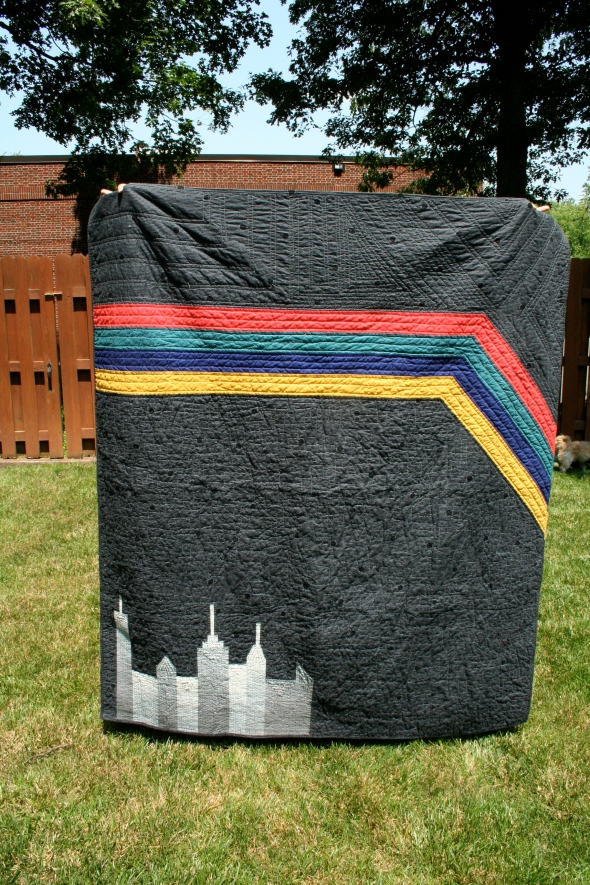 Black Quilt with Negative Space, City Skyline and Stripes